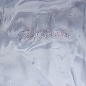 White Satin Bridal Robe “the bride” embroidered on the back with pink letters